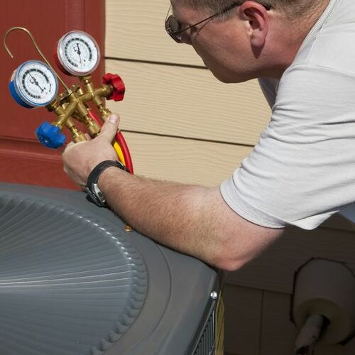 A Technician Tests an AC.