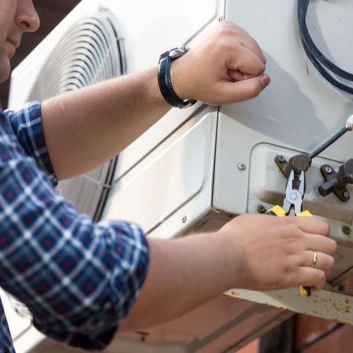 A Technician Provides Emergency Air Conditioner Repair.