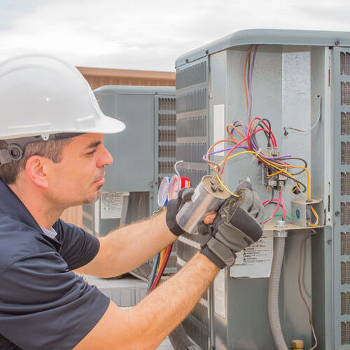 A Technician Replaces a Capacitor.